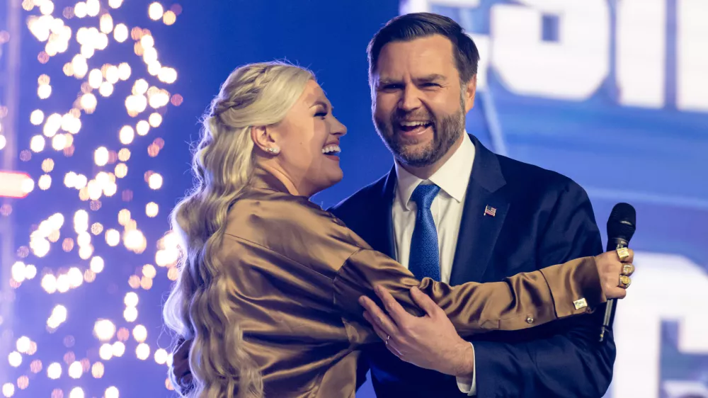 Erika Kirk greets Vice President JD Vance during Turning Point USA's AmericaFest 2025, Sunday, Dec. 21, 2025, in Phoenix. (AP Photo/Jon Cherry)