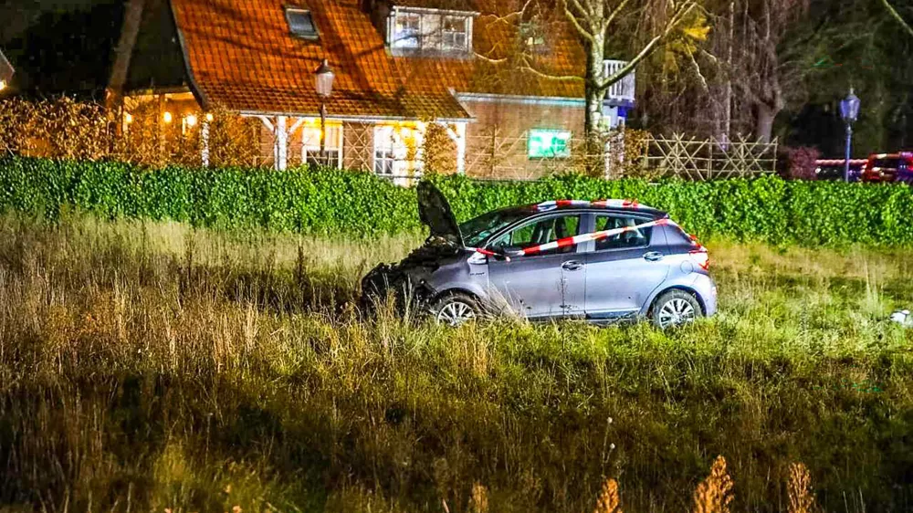 22 December 2025, Netherlands, Nunspeet: A car stands in the grass after a serious accident on the Elburgerweg. A car has driven into a crowd of people in the Netherlands. Photo: -/ANP/dpa