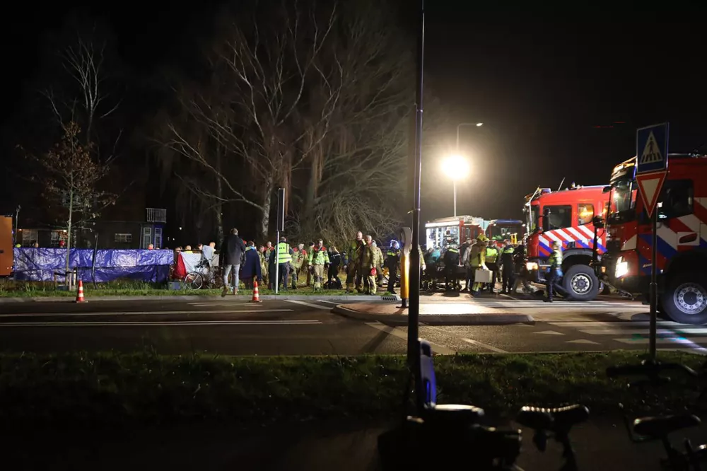 22 December 2025, Netherlands, Nunspeet: Rescue workers arrive after a serious accident on the Elburgerweg. A car has driven into a crowd of people in the Netherlands. Photo: -/ANP/dpa