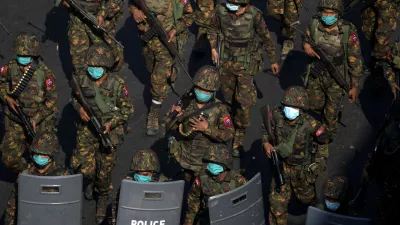 FILE PHOTO: Myanmar soldiers from the 77th light infantry division walk along a street during a protest against the military coup in Yangon, Myanmar, February 28, 2021. Picture taken February 28, 2021. REUTERS/Stringer/File Photo