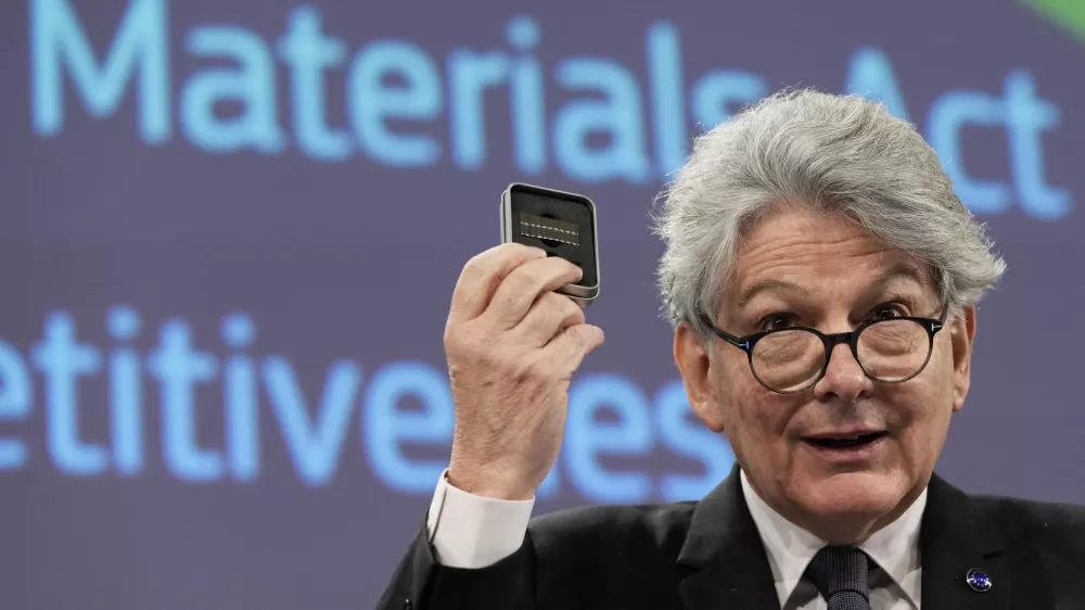 European Commissioner for Internal Market Thierry Breton holds up raw materials during a media conference after the weekly College of Commissioners meeting at EU headquarters in Brussels, Thursday, March 16, 2023. The College on Thursday discussed the Critical Raw Materials Act, the EU's long-term competitiveness strategy, and 30 years of the Single Market. (AP Photo/Virginia Mayo)