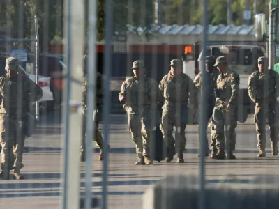 FILE PHOTO: National Guard members walk at the U.S. Immigration and Customs Enforcement (ICE) Broadview facility in Chicago, Illinois, U.S., October 9, 2025. REUTERS/Jeenah Moon/File Photo