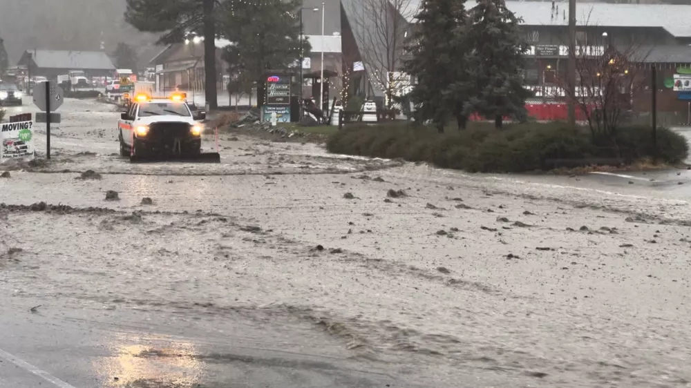 A vehicle moves through a flooded street during torrential rains, in San Bernardino County, California, U.S. December 24, 2025, in this screengrab obtained from a social media video. Damian Nikodem/via REUTERS THIS IMAGE HAS BEEN SUPPLIED BY A THIRD PARTY. MANDATORY CREDIT. NO RESALES. NO ARCHIVES.  VERIFICATION LINES: - Reuters was able to verify the location and date of the video from original file metadata from the source. - The buildings, road layout and business signages matched file imagery of the area.