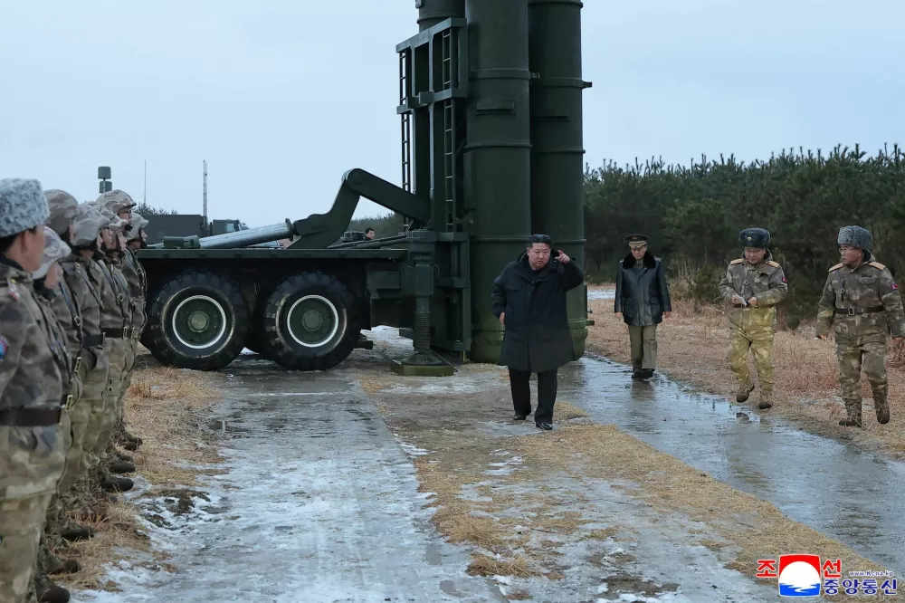 North Korean leader Kim Jong Un visits the site of a test-firing of a long-range surface-to-air missile near the East Sea, December 24, 2025 in this picture released by North Korea's official Korean Central News Agency on December 25, 2025. KCNA via REUTERS  ATTENTION EDITORS - THIS IMAGE WAS PROVIDED BY A THIRD PARTY. REUTERS IS UNABLE TO INDEPENDENTLY VERIFY THIS IMAGE. NO THIRD PARTY SALES. SOUTH KOREA OUT. NO COMMERCIAL OR EDITORIAL SALES IN SOUTH KOREA.
