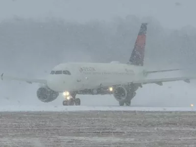 A Delta Air Lines plane prepares to take off during a winter storm at Greater Rochester International Airport in Rochester, New York, U.S., December 26, 2025, in this screengrab obtained from a social media video. Joseph Frascati/via REUTERS THIS IMAGE HAS BEEN SUPPLIED BY A THIRD PARTY. MANDATORY CREDIT. NO RESALES. NO ARCHIVES. VERIFICATION: Reuters was able to verify the location from runway, buildings, and utility tower which matched file and satellite images. Reuters was able to verify the date of the footage from original file metadata.