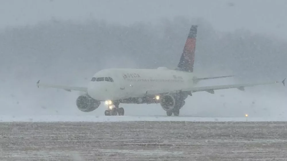 A Delta Air Lines plane prepares to take off during a winter storm at Greater Rochester International Airport in Rochester, New York, U.S., December 26, 2025, in this screengrab obtained from a social media video. Joseph Frascati/via REUTERS THIS IMAGE HAS BEEN SUPPLIED BY A THIRD PARTY. MANDATORY CREDIT. NO RESALES. NO ARCHIVES. VERIFICATION: Reuters was able to verify the location from runway, buildings, and utility tower which matched file and satellite images. Reuters was able to verify the date of the footage from original file metadata.