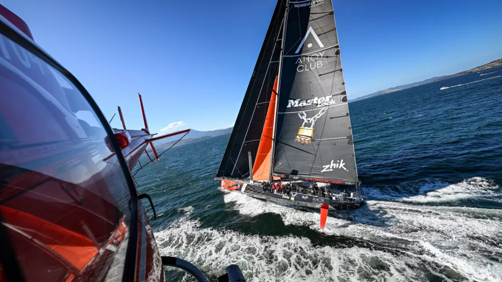 In this photo provided by the Cruising Yacht Club of Australia, Comanche crosses the finish line in Hobart, Australia, Sunday, Dec. 28, 2025, to claim line honors in the Sydney Hobart yacht race. (Kurt Arrigo/CYCA via AP)