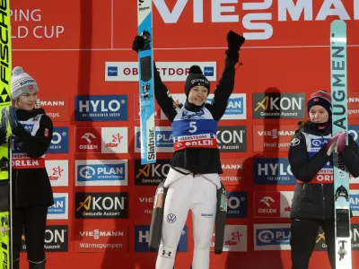 01 January 2025, Bavaria, Oberstdorf: Slovenia's Ski jumper winner Nika Prevc (C) celebrates alongside Norway's second placed Anna Odine Stroem (L) and third placed Eirin Maria Kvandal after the women's large hill 2nd round of the ski jumping Two Nights Tour. Photo: Karl-Josef Hildenbrand/dpa