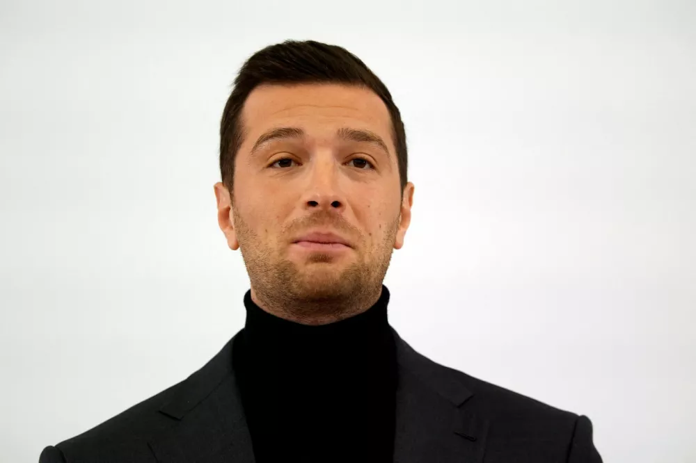 Jordan Bardella, president of the French far-right National Rally (Rassemblement National - RN) political party, delivers his New Year's speech to the press in Paris, France, January 27, 2025. REUTERS/Gonzalo Fuentes