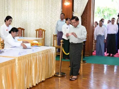 Myanmar's junta chief Min Aung Hlaing walks inside Zayarthiri polling station to vote, on the day of the general elections in Naypyitaw, Myanmar, December 28, 2025. Myanmar Military Information Team/Handout via REUTERS  THIS IMAGE HAS BEEN SUPPLIED BY A THIRD PARTY. NO RESALES. NO ARCHIVES