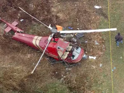 Authorities look over the scene after two helicopters crashed in Hammonton, N.J., on Sunday, Dec. 28, 2025. (WPVI-TV/6ABC via AP)