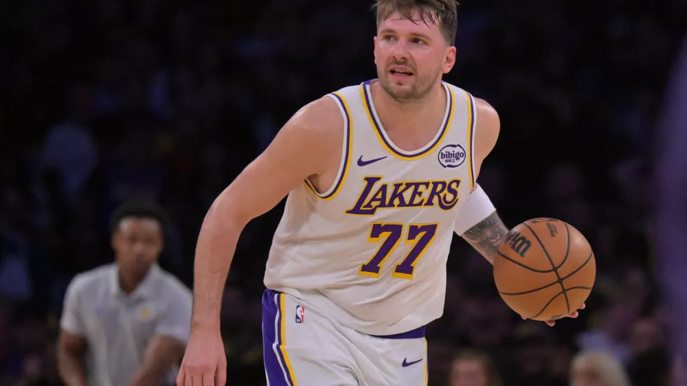 Dec 28, 2025; Los Angeles, California, USA; Los Angeles Lakers guard Luka Doncic (77) handles the ball in the second half against the Sacramento Kings at Crypto.com Arena. Mandatory Credit: Jayne Kamin-Oncea-Imagn Images