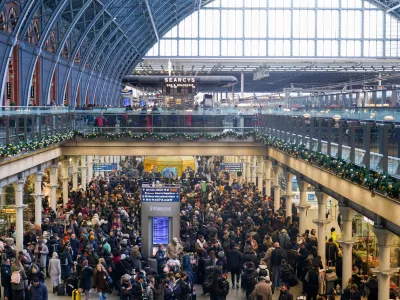 Travellers queue for Eurostar services at St Pancras International station in London, Tuesday, Dec. 30, 2025. (AP Photo/Alberto Pezzali)
