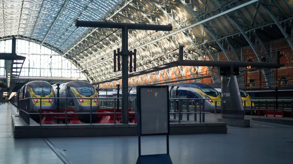 Eurostar trains at platforms as travellers queue for the service at St Pancras International station in London, Tuesday, Dec. 30, 2025. (AP Photo/Alberto Pezzali)