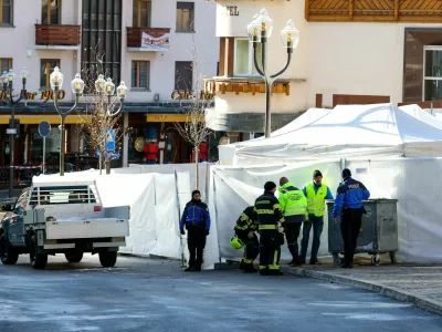 Emergency personnel work at the site of an explosion and fire at the "Le Constellation" bar, where several people died and others were injured after an explosion tore through a crowded New Year's Eve party, according to Swiss police, in the upscale ski resort of Crans-Montana in southwestern Switzerland, January 1, 2026. REUTERS/Denis Balibouse   TPX IMAGES OF THE DAY