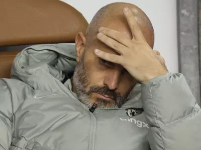 FILE - Chelsea's head coach Enzo Maresca sits on a bench ahead of the Champions League opening phase soccer match between Qarabag and Chelsea in Baku, Azerbaijan, on Nov. 5, 2025. (AP Photo, File)