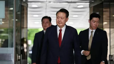 FILE PHOTO: Former South Korean President Yoon Suk Yeol arrives at a court to attend a hearing to review his arrest warrant requested by special prosecutors in Seoul, South Korea, July 9, 2025.  REUTERS/Kim Hong-Ji/Pool/File Photo