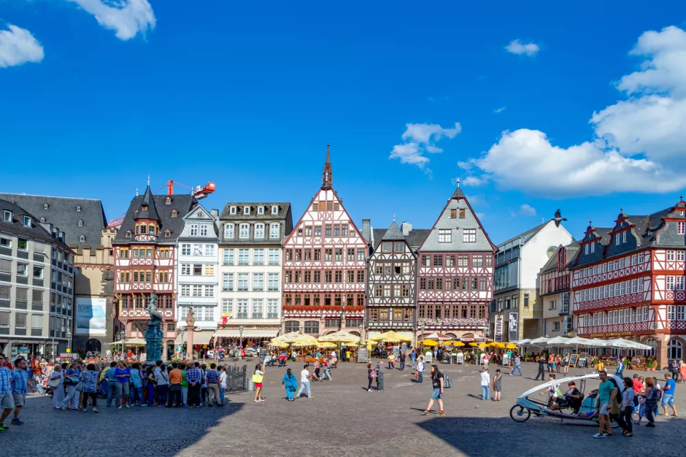 Frankfurt, Germany - August 9, 2024: people enjoy visiting the central historic square in Frankfurt, the R&ouml;mer with beautiful half timbered houses.