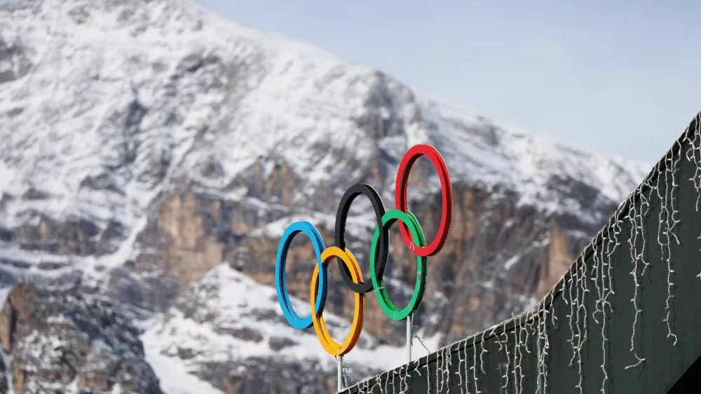 FILE PHOTO: A general view shows the Olympic rings on the Cortina Curling Olympic Stadium, which will host the curling, wheelchair curling, and Paralympic closing ceremony during the Milano Cortina Winter Olympic Games 2026, in Cortina, Italy, January 25, 2025. REUTERS/Claudia Greco/File Photo/File Photo
