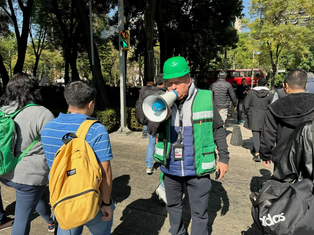 A man uses a megaphone after an earthquake alarm sounded, in Mexico City, Mexico, January 2,, 2025. REUTERS/Henry Romero