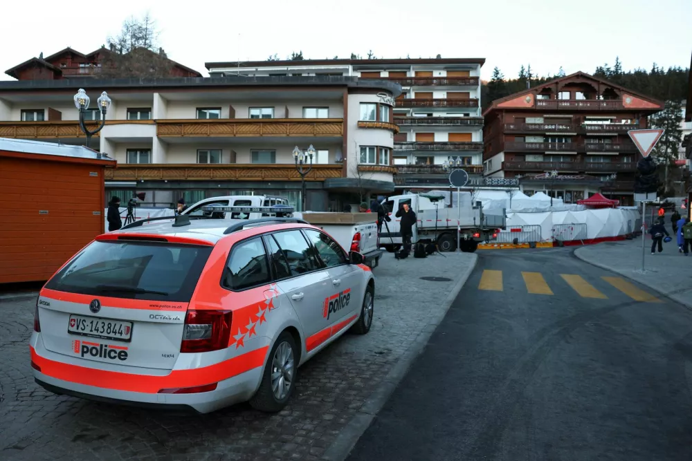 A police vehicle stands outside the "Le Constellation" bar, after a deadly fire and explosion during a New Year's Eve party in the upscale ski resort of Crans-Montana in southwestern Switzerland, January 3, 2026. REUTERS/Denis Balibouse