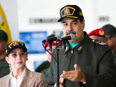 FILE PHOTO: Venezuela's President Nicolas Maduro and his wife Cilia Flores attend a year-end salutation to military forces in La Guaira, Venezuela December 28, 2025. Miraflores Palace/Handout via REUTERS ATTENTION EDITORS - THIS IMAGE HAS BEEN SUPPLIED BY A THIRD PARTY/File Photo