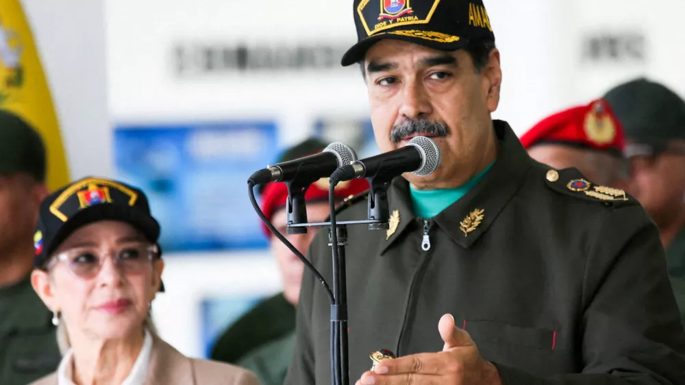 FILE PHOTO: Venezuela's President Nicolas Maduro and his wife Cilia Flores attend a year-end salutation to military forces in La Guaira, Venezuela December 28, 2025. Miraflores Palace/Handout via REUTERS ATTENTION EDITORS - THIS IMAGE HAS BEEN SUPPLIED BY A THIRD PARTY/File Photo