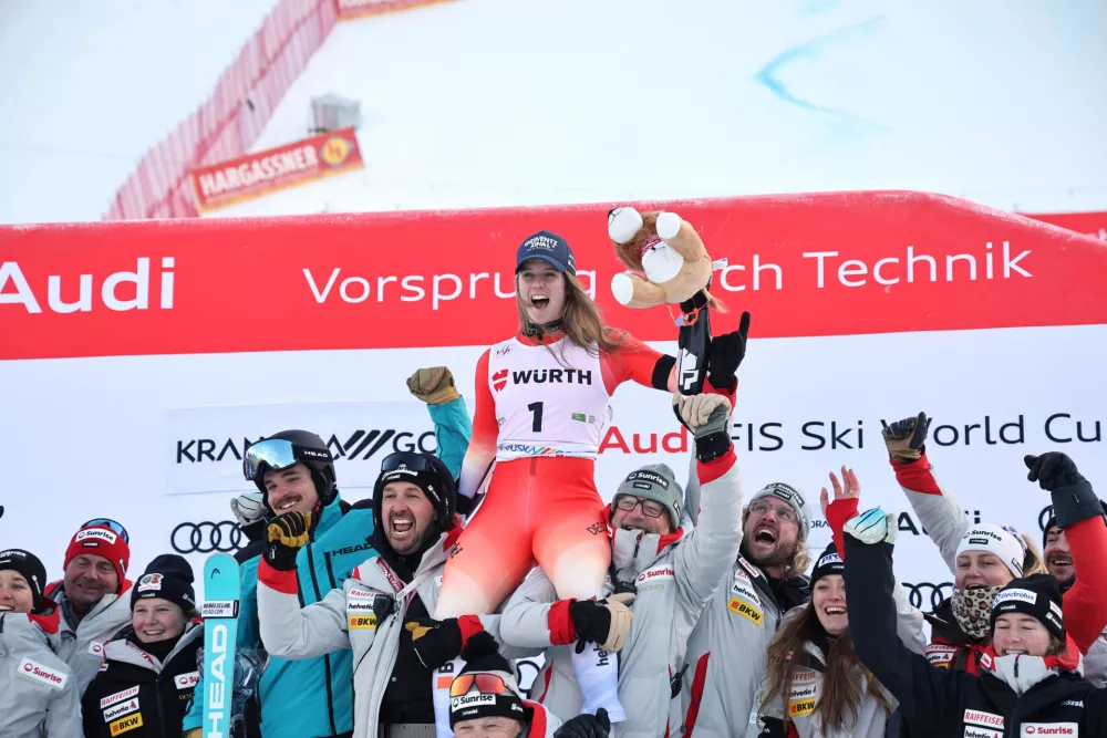 Switzerland's Camille Rast celebrates with team Switzerland after during an alpine ski, women's World Cup giant slalom in Kranjska Gora, Slovenia, Saturday, Jan. 3, 2026. (AP Photo/Marco Trovati)