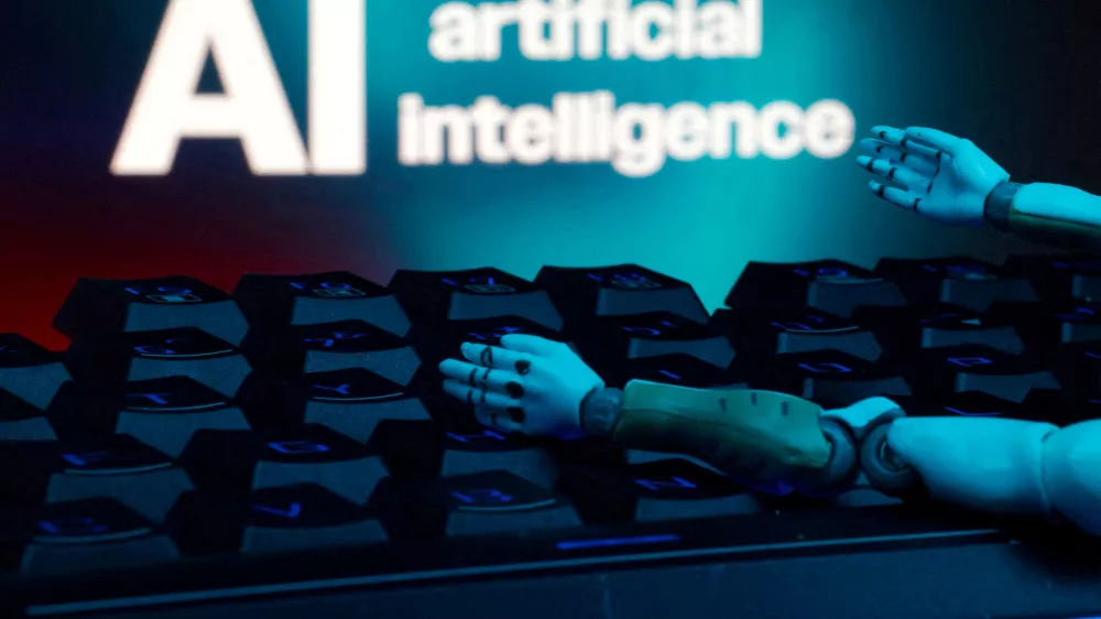 FILE PHOTO: A message reading "AI artificial intelligence", a keyboard, and robot hands are seen in this illustration taken January 27, 2025. REUTERS/Dado Ruvic/Illustration/File Photo