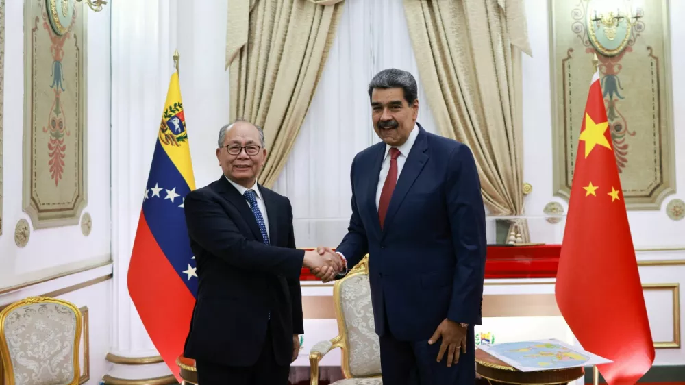 Venezuela's President Nicolas Maduro and Special Representative of the Chinese Government on Latin American Affairs Qiu Xiaoqi meet at the Miraflores Palace, in Caracas, Venezuela January 2, 2026. Marcelo Garcia/Miraflores Palace/Handout via REUTERS ATTENTION EDITORS - THIS IMAGE HAS BEEN SUPPLIED BY A THIRD PARTY