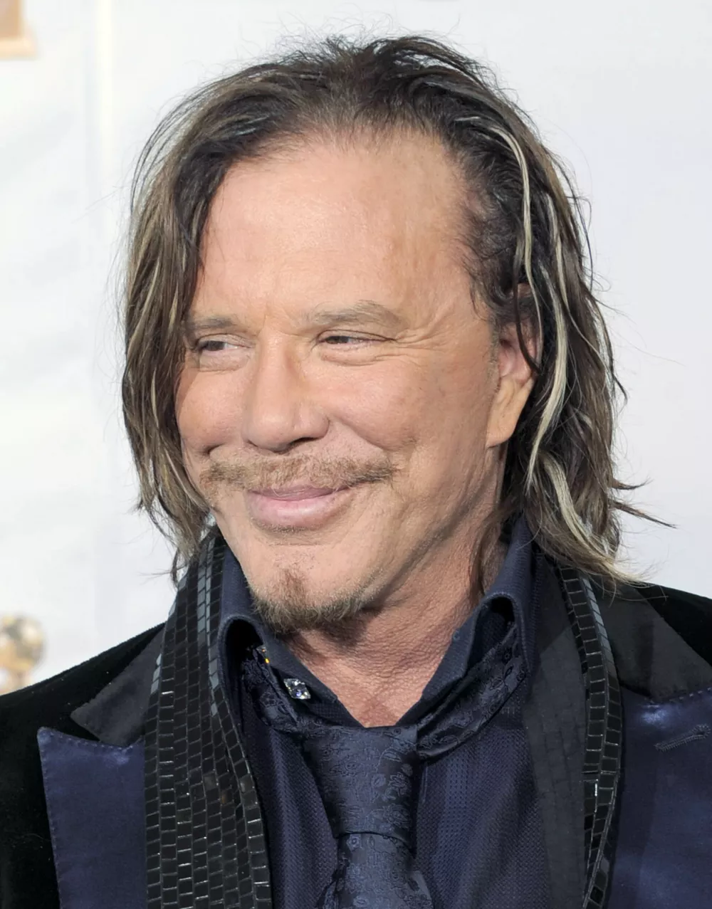 ** FILE ** In this Jan. 11, 2009 file photo, Mickey Rourke is shown at the 66th Annual Golden Globe Awards in Beverly Hills, Calif. Rourke was nominated for an Academy Award for best actor, Thursday, Jan. 22, 2009, for his role in "The Wrestler." The 81st Oscars will be presented Feb. 22 in a ceremony airing on ABC from Hollywood's Kodak Theatre. (AP Photo/Mark J. Terrill, file)