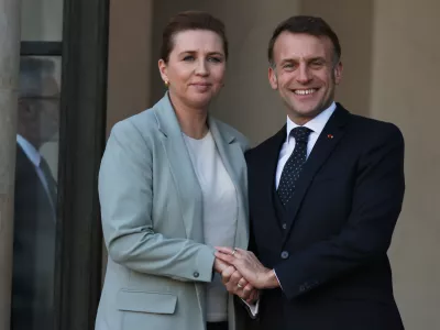 French President Emmanuel Macron welcomes Denmark's Prime Minister Mette Frederiksen before a meeting of the 'Coalition of the Willing' on Ukraine, in Paris, France, Tuesday, Jan. 6, 2026. (AP Photo/Thomas Padilla)