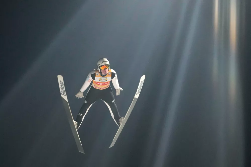 Domen Prevc, of Slovenia, soars through the air during his first round jump at the fourth stage of the Four Hills ski jumping tournament in Bischofshofen, Austria, Tuesday, Jan. 6, 2026. (AP Photo/Matthias Schrader)