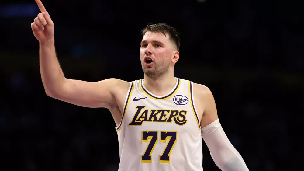 Jan 4, 2026; Los Angeles, California, USA; Los Angeles Lakers guard Luka Doncic (77) reacts to a play during the third quarter against the Memphis Grizzlies at Crypto.com Arena. Mandatory Credit: Kiyoshi Mio-Imagn Images