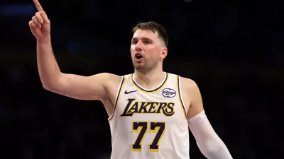 Jan 4, 2026; Los Angeles, California, USA; Los Angeles Lakers guard Luka Doncic (77) reacts to a play during the third quarter against the Memphis Grizzlies at Crypto.com Arena. Mandatory Credit: Kiyoshi Mio-Imagn Images