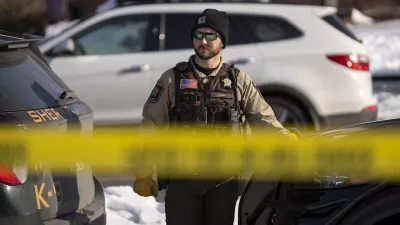 07 January 2026, US, Minneapolis: A Minneapolis Police Department member stands at the scene of a shooting involving a Federal ICE agent in South Minneapolis. An ICE officer fatally shot a woman Wednesday morning in south Minneapolis, where federal and local law enforcement have clashed for hours with protesters. Photo: Mark Brown/ZUMA Press Wire/dpa