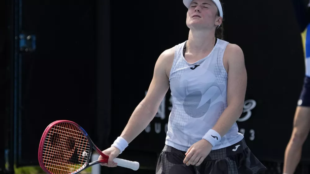 Tamara Zidansek of Slovenia reacts during her first round match against Anastasia Potapova of Russia at the Australian Open tennis championship in Melbourne, Australia, Monday, Jan. 13, 2025. (AP Photo/Manish Swarup)