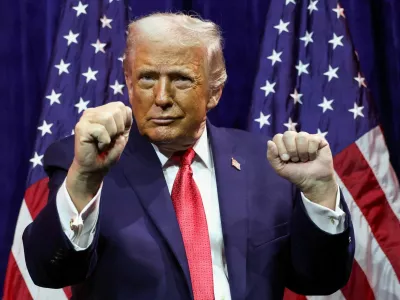 FILE PHOTO: U.S. President Donald Trump gestures as he addresses House Republicans at their annual issues conference retreat, at the Kennedy Center, renamed the Trump-Kennedy Center by the Trump-appointed board of directors, in Washington, D.C., U.S., January 6, 2026. REUTERS/Kevin Lamarque/File Photo