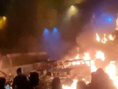 Protesters gather as vehicles burn, amid evolving anti-government unrest, in Tehran, Iran, in this screen grab obtained from a social media video released on January 9, 2026. Social Media/via REUTERS THIS IMAGE HAS BEEN SUPPLIED BY A THIRD PARTY. NO RESALES. NO ARCHIVES. REFILE - QUALITY REPEAT VERIFICATION: - Buildings, business signage and traffic light matched file and satellite imagery - Date not verified - Witnesses told Reuters protesters gathered in the streets on Thursday (January 8)