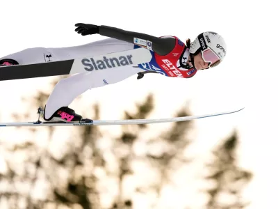 FILE - Nika Prevc, of Slovenia, soars through the air during her first round jump of the ski jumping women's large hill individual competition at the Nordic World Ski Championships in Trondheim, Norway, March 7, 2025. (AP Photo/Matthias Schrader, File)