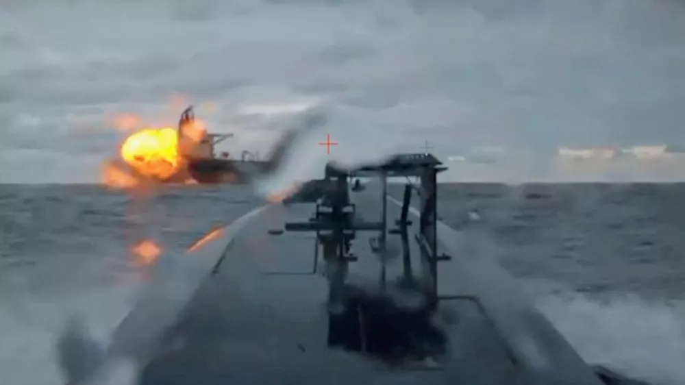 A Ukrainian sea drone shows the Dashan, a tanker part of Russia's so-called "shadow fleet", being struck by another sea drone in the Black Sea, December 10, 2025, in this picture obtained from a video. Shared by Security Service Official/Handout via REUTERS  THIS IMAGE HAS BEEN SUPPLIED BY A THIRD PARTY. Verification note: Reuters was able to verify the video showed the Dashan tanker by comparing the deck, cranes and structures with file imagery. The location and date were confirmed by the SBU source's account and ship tracking data.