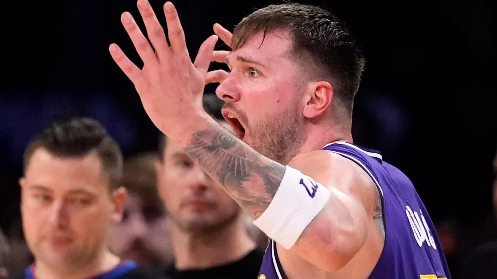 Los Angeles Lakers guard Luka Doncic reacts after being called for a foul during the second half of an NBA basketball game against the Milwaukee Bucks, Friday, Jan. 9, 2026, in Los Angeles. (AP Photo/Mark J. Terrill)