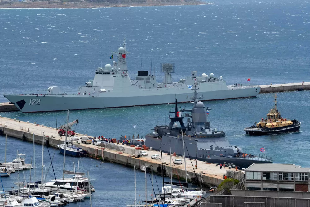The Chinese guided-missile destroyer Tangshan, left, and the Russian corvette Stoikiy, right, in the Simon's Town harbour, in Cape Town, South Africa, Friday, Jan. 9, 2026. (AP Photo/Nardus Engelbrecht)