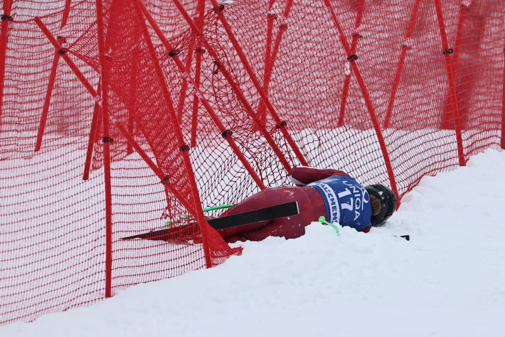 Austria's Magdalena Egger lies on the snow after crashing during an alpine ski, women's World Cup downhill, in Zauchensee, Austria, Saturday, Jan. 10, 2026. (AP Photo/Marco Trovati)