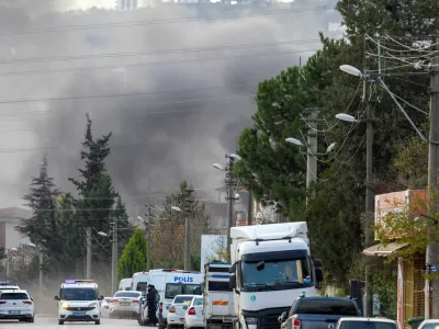 Smoke rises in the background as police block a road leading to a site where Turkish police launched an operation on a house believed to contain suspected Islamic State militants, and where, according to state media, seven officers were wounded in a clash, in Yalova province, Turkey, December 29, 2025. REUTERS/Umit Bektas   TPX IMAGES OF THE DAY