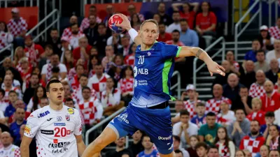 Handball - IHF Handball World Championships 2025 - Main Round IV - Croatia v Slovenia - Zagreb Arena, Zagreb, Croatia - January 26, 2025 Slovenia's Tilen Kodrin scores a goal REUTERS/Antonio Bronic