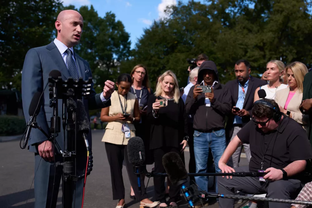 White House deputy chief of staff Stephen Miller speaks with reporters at the White House, Monday, Oct. 6, 2025, in Washington. (AP Photo/Evan Vucci)