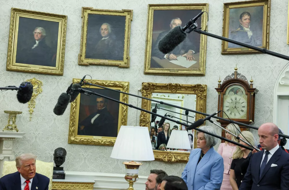 FILE PHOTO: U.S. Vice President JD Vance, U.S. White House Chief of Staff Susie Wiles, and U.S. White House deputy chief of staff Stephen Miller listen as U.S. President Donald Trump speaks during a meeting with Canadian Prime Minister Mark Carney (not pictured) in the Oval Office at the White House in Washington, D.C., U.S., May 6, 2025. REUTERS/Leah Millis/File Photo