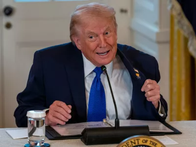 09 January 2026, US, Washington: US President Donald Trump shows off his new 'Happy Trump' lapel pin as he hosts the leaders of nearly two dozen oil companies in the White House East Room to discuss Venezuela. Photo: Andrew Leyden/ZUMA Press Wire/dpa