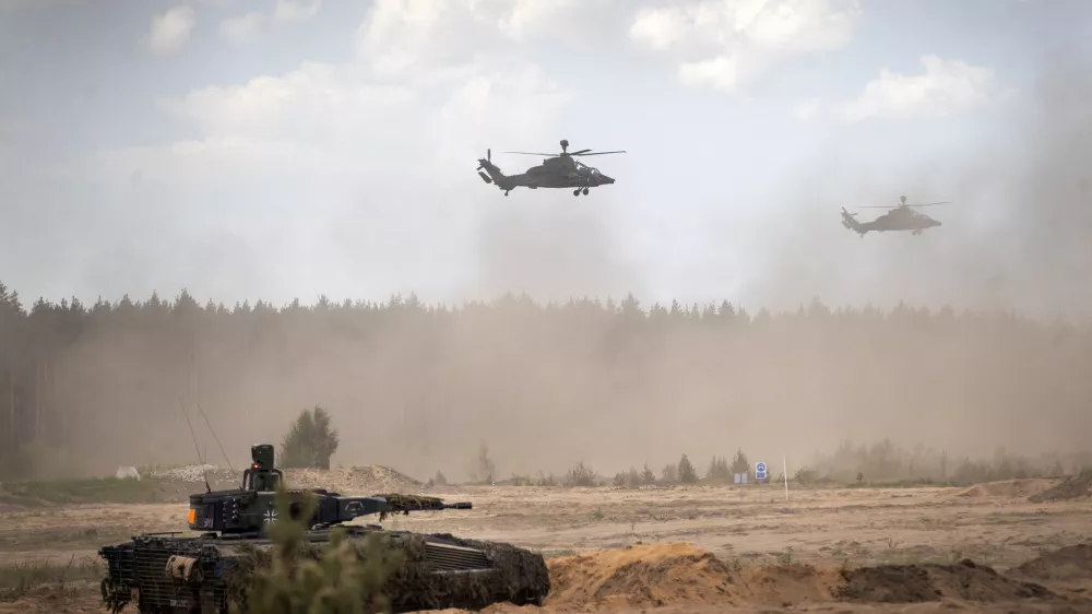 FILE - Eurocopters Tiger of the German Army take part in the Lithuanian-German division-level international military exercise 'Grand Quadriga 2024' at a training range in Pabrade, north of the capital Vilnius, Lithuania on May 29, 2024. (AP Photo/Mindaugas Kulbis, File)